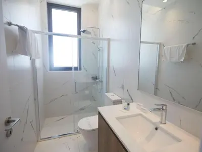 a bathroom with a sink and a shower and a toilet at Holiday Home Protaras Almaria Villa ALM08 by Interhome in Protaras
