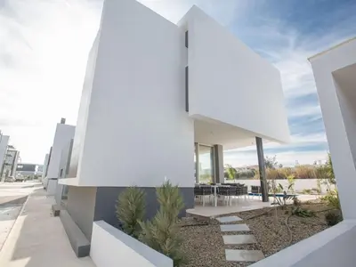 a view of the facade of a white house at Holiday Home 3-Schlafzimmer-Villa mit privatem Pool im Zentrum by Interhome in Protaras