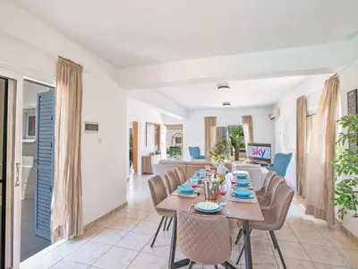 a dining room with a table and chairs at Holiday Home in Protaras mit privatem Parkplatz by Interhome in Protaras
