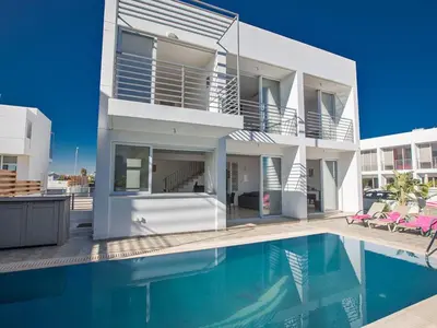 a house with a swimming pool in front of it at Holiday Home Protaras Perle Villa PE15 by Interhome in Protaras