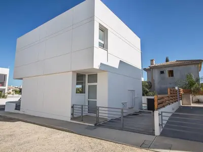 a white building with a staircase on the side of it at Holiday Home Protaras Perle Villa PE15 by Interhome in Protaras