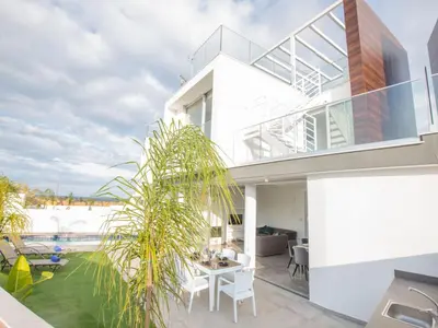 a house with a view of the ocean at Holiday Home 2-Schlafzimmer-Villa mit Pool- Dachgarten- Meerblick by Interhome in Protaras
