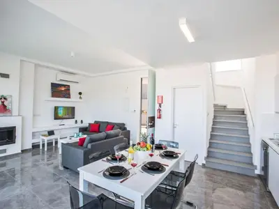 a living room with a table and a couch at Holiday Home Protaras Olivine Villa mit Pool und einem Dachgarten by Interhome in Protaras