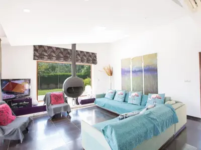 a living room with two couches and a tv at Holiday Home 4-Schlafzimmer-Villa mit Pool im Zentrum von Protaras by Interhome in Protaras