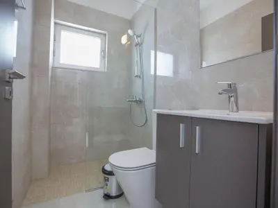 a bathroom with a shower and a toilet and a sink at Holiday Home 3-Schlafzimmer-Villa mit privatem Pool im Zentrum by Interhome in Protaras