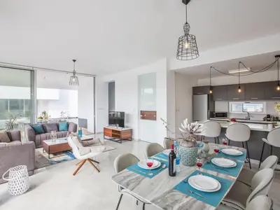 a living room with a table and chairs at Holiday Home 3-Schlafzimmer-Villa mit privatem Pool im Zentrum by Interhome in Protaras
