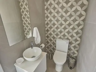 a small bathroom with a toilet and a sink at Holiday Home Protaras Elite Perle Villa EP3C by Interhome in Protaras