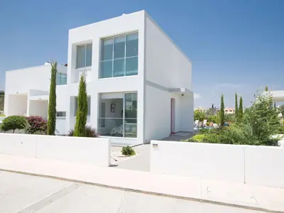 a white house with trees in front of it at Holiday Home Protaras Greco Villa CCV2 by Interhome in Protaras