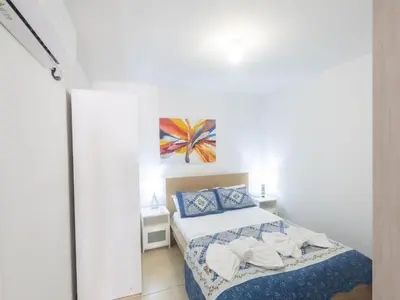 a small bedroom with a bed and a painting on the wall at Holiday Home Ferienvilla für 10 Personen in Protaras by Interhome in Protaras