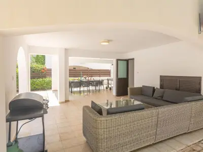 a living room with a couch and a table at Holiday Home Ferienvilla für 10 Personen in Protaras by Interhome in Protaras
