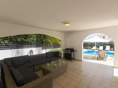 a living room with a couch and a table at Holiday Home Ferienvilla für 10 Personen in Protaras by Interhome in Protaras