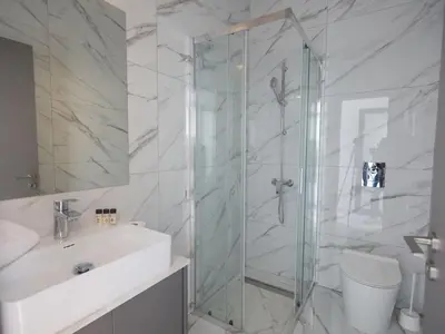 a bathroom with a shower and a sink at Holiday Home Protaras Aqua Pearl Villa AQ12 by Interhome in Protaras