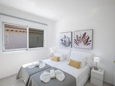 a white bedroom with a bed and a window at Holiday Home Eleganter Urlaub Artizan Villa AR5 by Interhome in Protaras