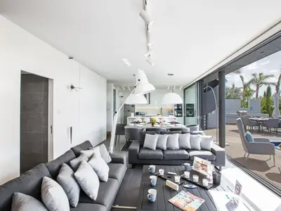 a living room with a couch and a table at Holiday Home Haus in Paralimni mit großem Patio by Interhome in Paralimni