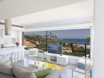 a living room with a view of the ocean at Apartment Luxuriöse Wohnung am Strand von Thalassa by Interhome in Protaras