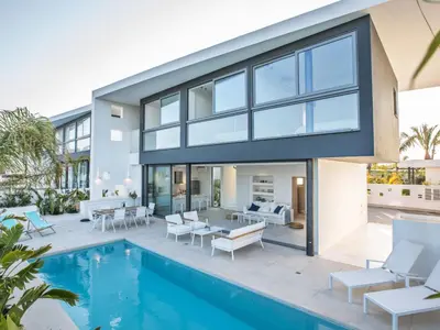 a house with a swimming pool and a patio at Holiday Home Neue- moderne 3-Schlafzimmer-Villa mit privatem Pool by Interhome in Paralimni
