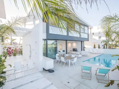 a villa with a swimming pool and a house at Holiday Home Neue- moderne 3-Schlafzimmer-Villa mit privatem Pool by Interhome in Paralimni