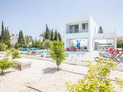 a villa with a swimming pool and a house at Holiday Home Protaras Greco Villa CCV1 mit beheiztem Pool by Interhome in Protaras