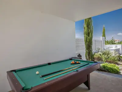 a pool table in a living room with a view at Holiday Home Protaras Greco Villa CCV1 mit beheiztem Pool by Interhome in Protaras