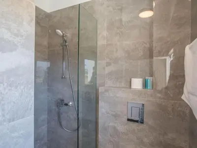 a bathroom with a shower with a glass door at Holiday Home Protaras Vie Bleu Villa VB5 by Interhome in Protaras