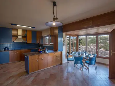 a kitchen with a table and chairs and a dining room at Holiday Home Private Villa mit Panoramablick auf das Meer by Interhome in Protaras