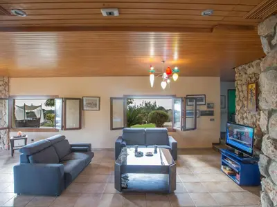 a living room with a couch and a tv at Holiday Home Private Villa mit Panoramablick auf das Meer by Interhome in Protaras
