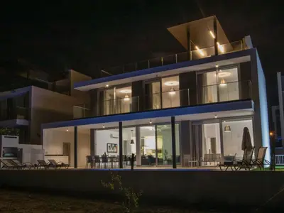 a large house at night with lights at Holiday Home Schöne Villa Olivine Pearl OL5 mit Garten by Interhome in Protaras