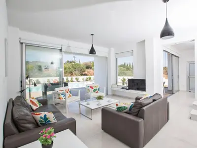 a living room with two couches and a tv at Holiday Home Neue Ferienvilla für 10 Personen by Interhome in Protaras