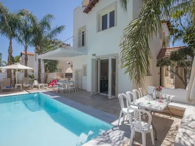 a villa with a swimming pool and a patio at Holiday Home 3-Schlafzimmer-Luxusvilla mit Pool und teilweise Meerblick by Interhome in Protaras
