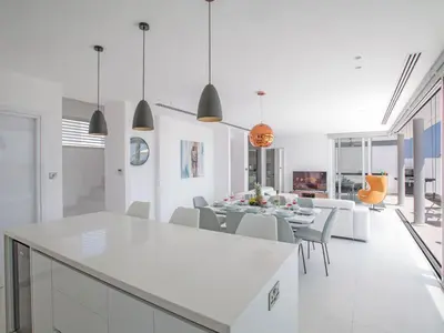 a kitchen and dining room with a table and chairs at Holiday Home Haus in Pernera mit Bi-Fold Patio by Interhome in Protaras