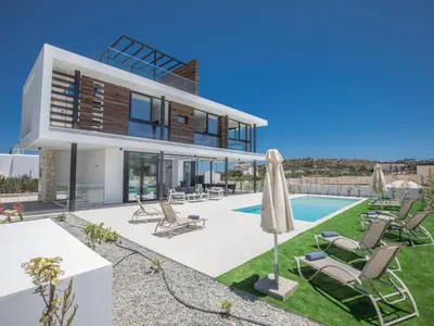 an image of a house with a swimming pool at Holiday Home Geräumige Villa mit großem Garten und Pool by Interhome in Protaras