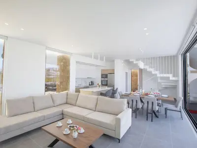 a living room with a couch and a table at Holiday Home Ferienvilla Vie Bleu mit großem Pool by Interhome in Protaras