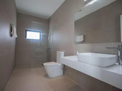 a bathroom with a sink and a toilet and a shower at Holiday Home in Protaras mit großem Garten by Interhome in Protaras