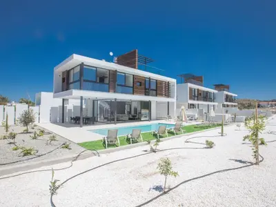 a large white house with a swimming pool at Holiday Home in Protaras mit großem Garten by Interhome in Protaras