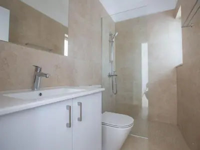 a bathroom with a toilet and a sink and a shower at Holiday Home 3-Schlafzimmer-Villa mit privatem Pool im Zentrum by Interhome in Protaras