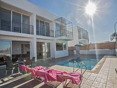 a villa with a swimming pool and a house at Holiday Home Protaras Perle Villa PE16 by Interhome in Protaras