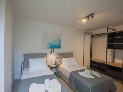 a bedroom with two beds and a bunk bed at Holiday Home mit Privatpool für 11 Personen ca- 220 m² in Protaras- Südküste von Zypern by Interhome in Protaras