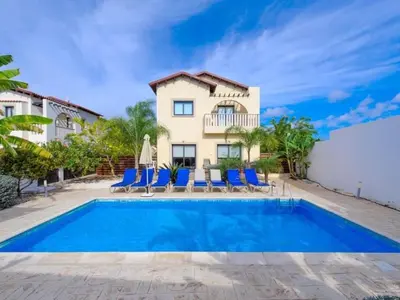 a villa with a swimming pool and a house at Holiday Home Protaras Ferienvilla AV6 by Interhome in Protaras