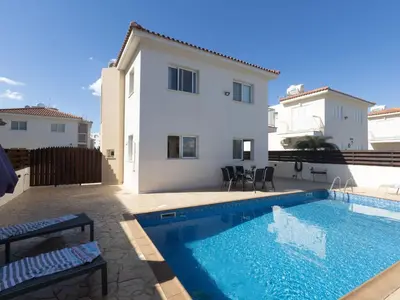 a swimming pool in front of a villa at Holiday Home Protaras Blauer Fluss Villa BR26 by Interhome in Protaras