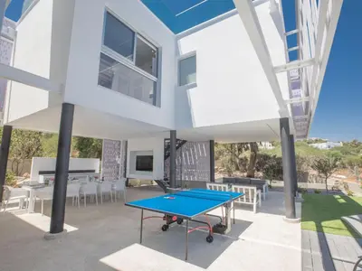 a ping pong table in the middle of a building at Holiday Home Ferienvilla Chloe mit Terrasse und Garten by Interhome in Protaras