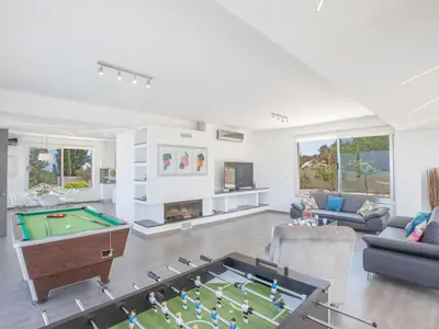 a living room with a pool table in it at Holiday Home Ferienvilla Chloe mit Terrasse und Garten by Interhome in Protaras