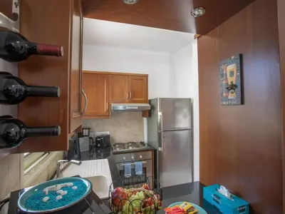 a kitchen with a sink and a stove top oven at Holiday Home Protaras Menelaos Villa MV7 by Interhome in Paralimni