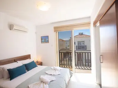 a bedroom with a bed and a large window at Holiday Home Protaras Menelaos Villa MV7 by Interhome in Paralimni
