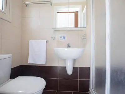 a bathroom with a sink and a toilet at Holiday Home Protaras Menelaos Villa MV7 by Interhome in Paralimni