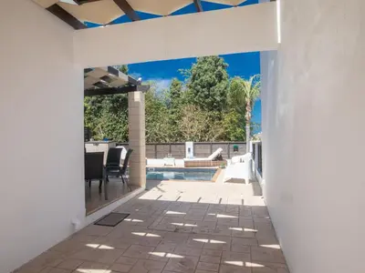 an internal view of a house with a patio and a swimming pool at Holiday Home Protaras Menelaos Villa MV7 by Interhome in Paralimni
