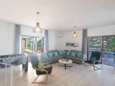 a living room with a couch and chairs at Holiday Home Ferienvilla Mo 3 für 10 Personen in Agia Napa by Interhome in Ayia Napa