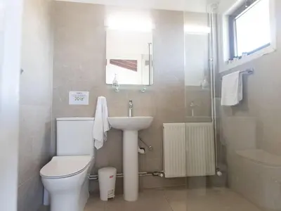 a bathroom with a toilet and a sink and a shower at Holiday Home Ferienvilla Mo 3 für 10 Personen in Agia Napa by Interhome in Ayia Napa