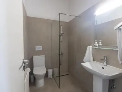 a bathroom with a toilet and a sink at Holiday Home Ferienvilla Mo 3 für 10 Personen in Agia Napa by Interhome in Ayia Napa