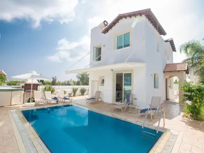 a villa with a swimming pool in front of a house at Holiday Home 3-Schlafzimmer-Villa mit privatem Pool by Interhome in Protaras