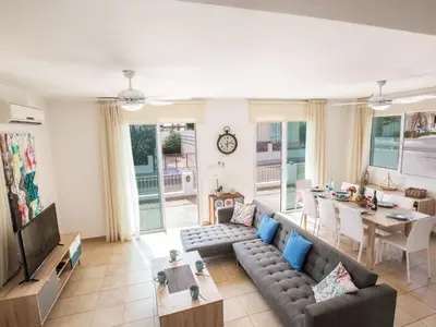 a living room with a couch and a table at Holiday Home 3-Schlafzimmer-Villa mit privatem Pool by Interhome in Protaras